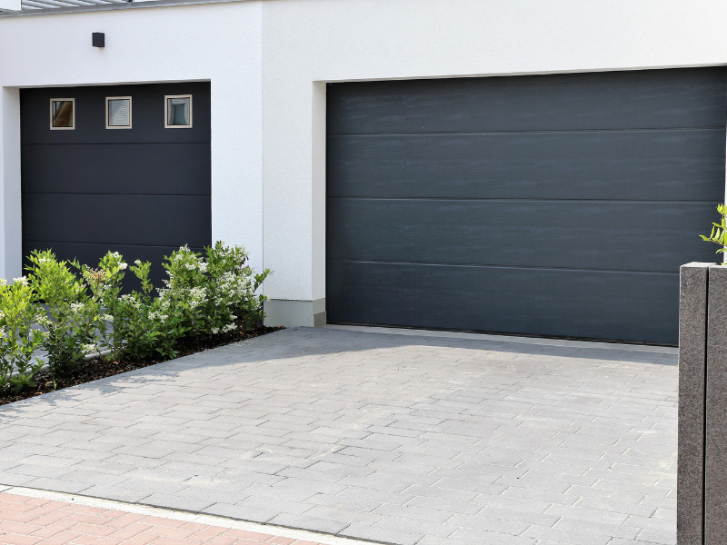 An image of a driveway and garage door