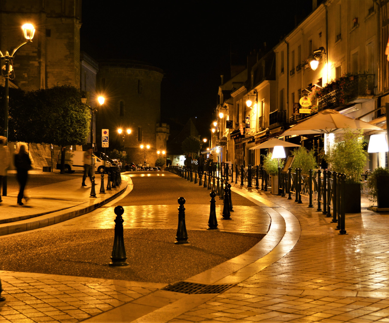 An image of a small town from the street at night