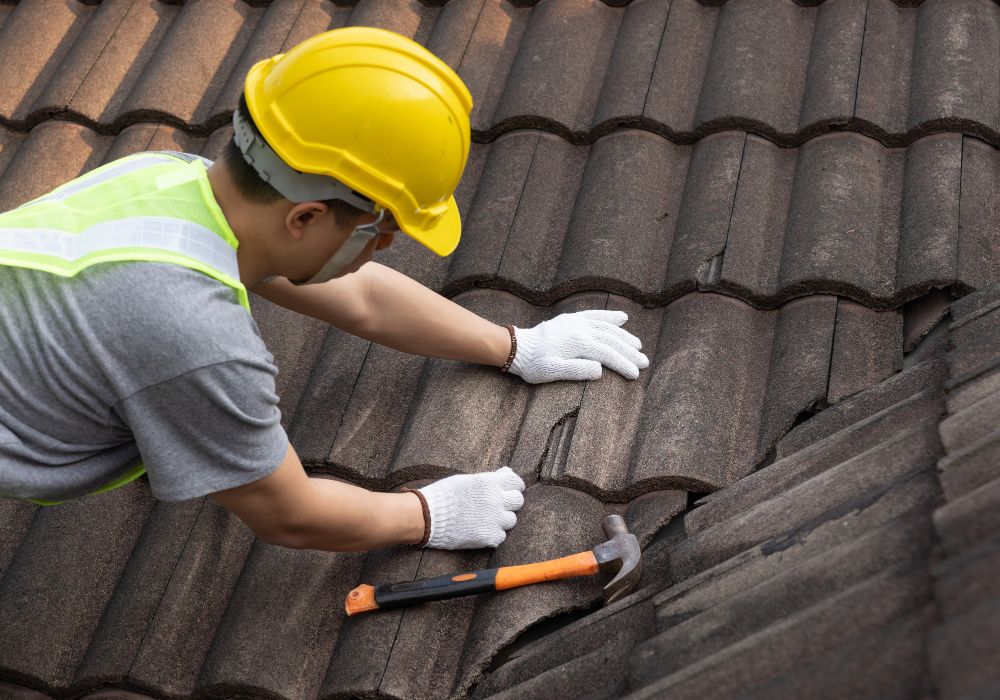 An image of someone repairing the roof