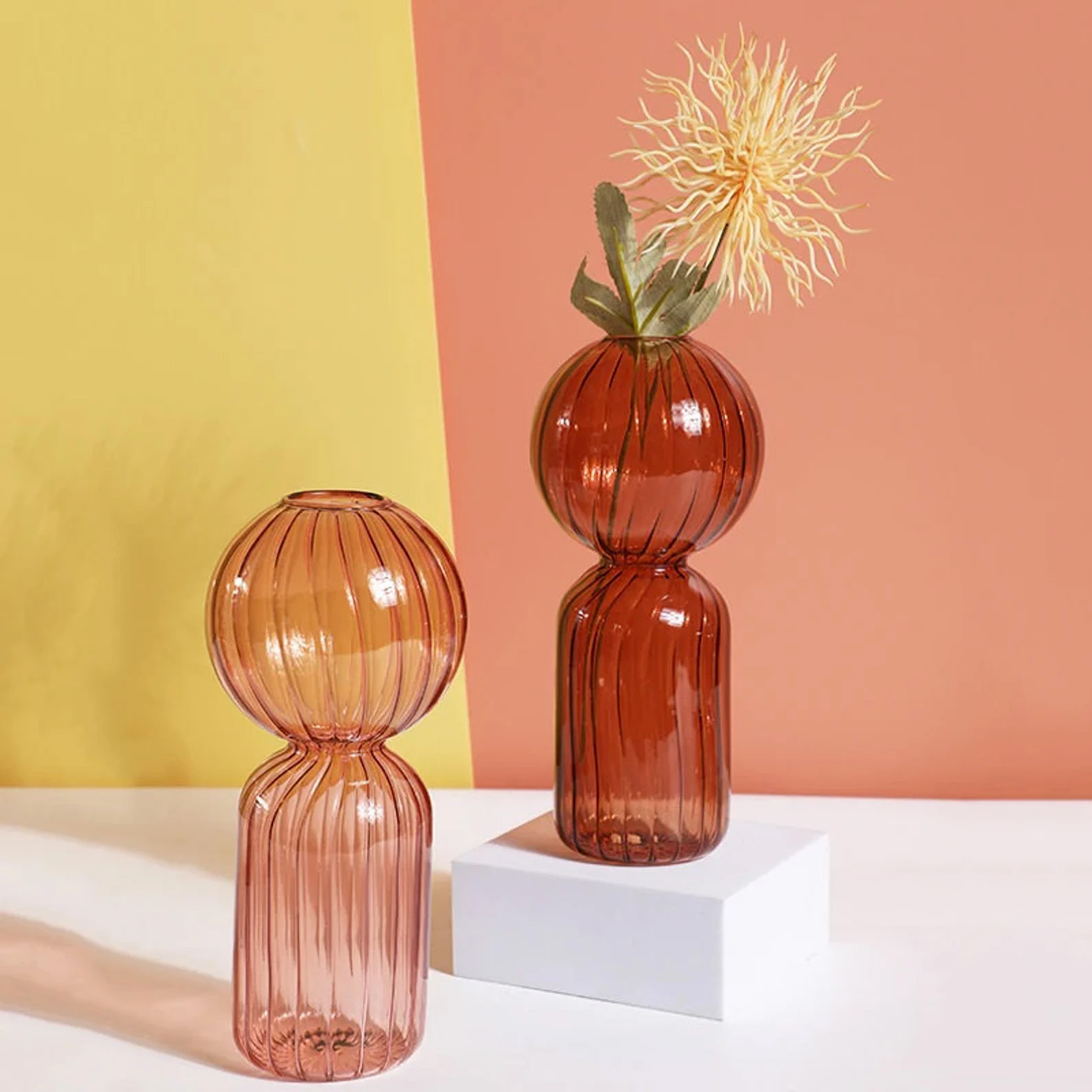 An image of two decorative flower vases