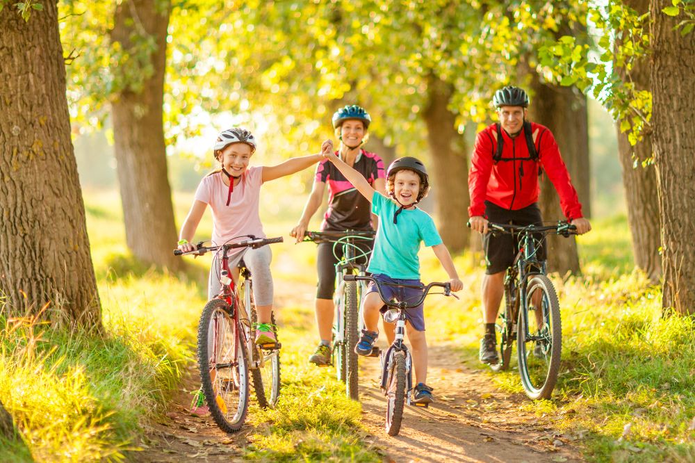 An image of a family enjoying an outdoor bike ride